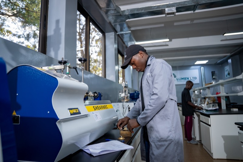 Technician setting up a direct shear test