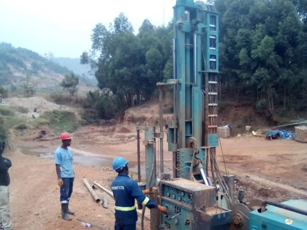 Track-mounted rotary rig positioned at the borehole location